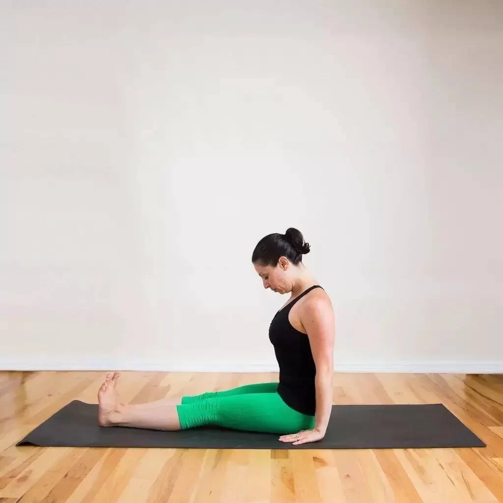 In Cane Pose, move your hips back to a seated forward bend.