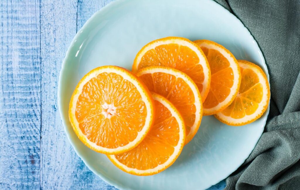 What are the benefits of oranges in the morning, Afternoon, and At